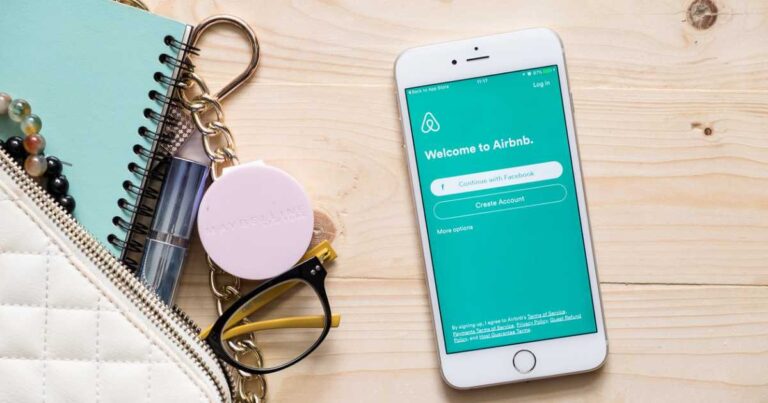 Apple iPhone 6s plus with Airbnb application on the screen