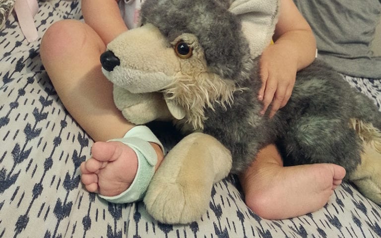 baby wearing owlet smart sock