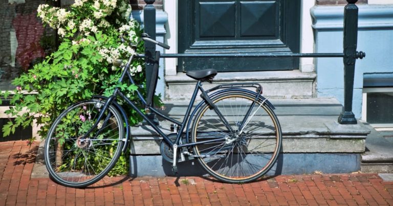 Bike parked in front of an apartment building