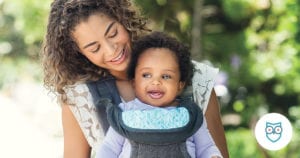 mom using baby carrier with baby