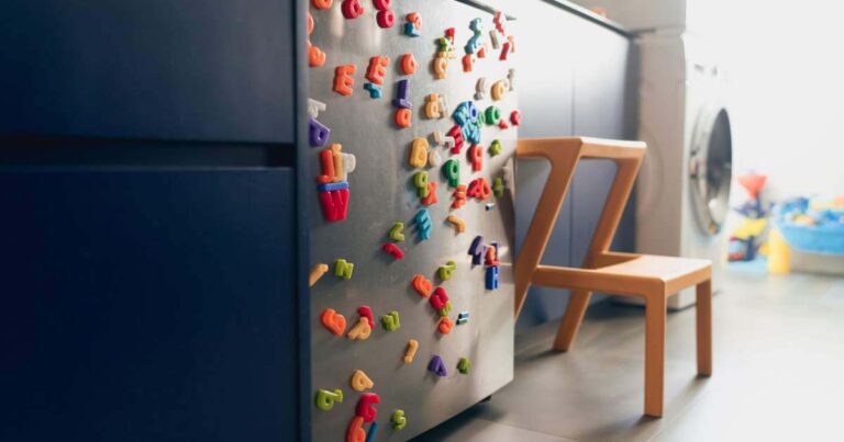 Colorfully decorated refrigerator with alphabet magnets of many colors