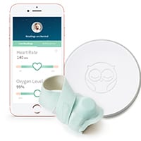 green owlet sock with base station and app on cell phone