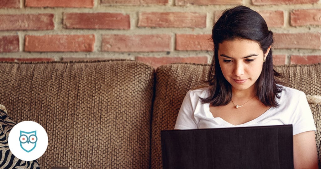 Woman using laptop in her home