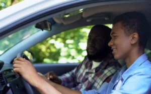teen driving with parent