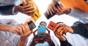 kids using smart phones together